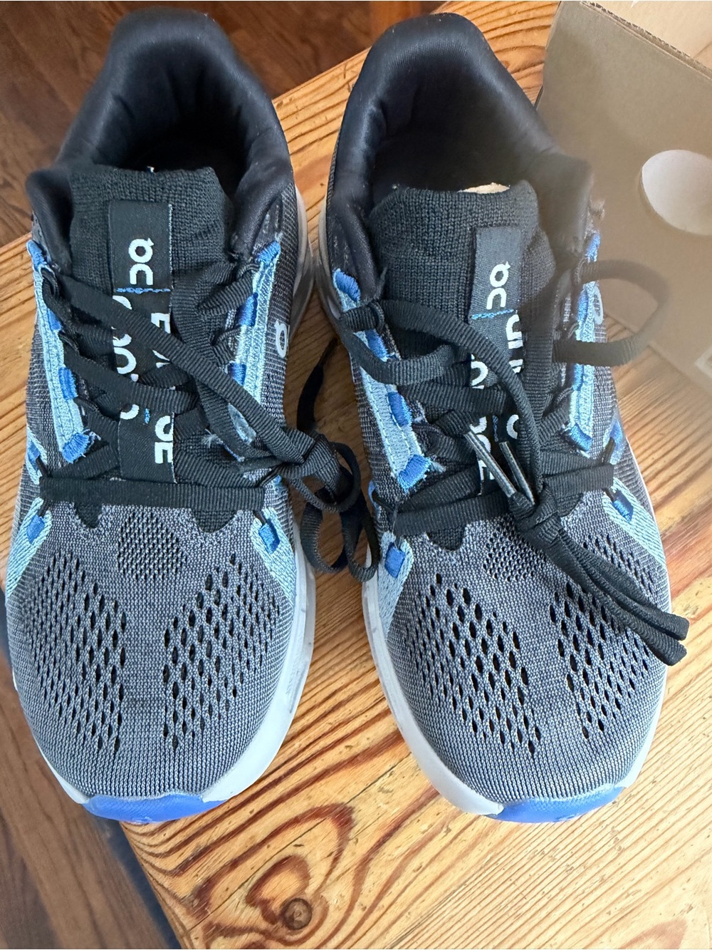 On Running , eclipse black/frost with Blue accents Women's Running Sneakers
